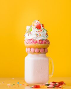 Close-Up Photo Of Dessert On Top Of The Jar