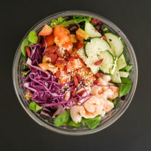 Mix of healthy fresh vegetables and shrimps in bowl